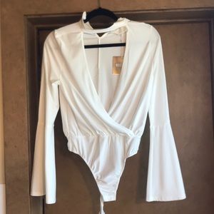 Adorable white body suit...never worn